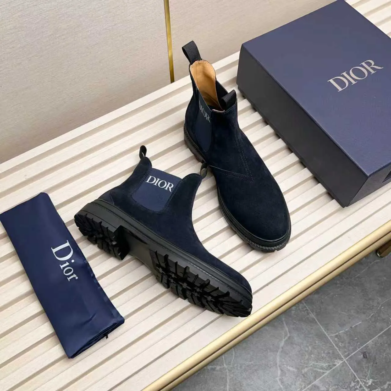 Men's Shoes 💰480 Dior A practical choice that combines protection with classic style. Made from durable Rugged Calf leather, it's tumbled and hand-finished to create a soft suede feel with a rich texture. Elastic side panels and subtle cutouts are inspired by the classic Chelsea boot. Leather upper and lining with Kummel tabs at front and rear, rubber outsole